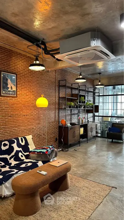 Stylish industrial living room with exposed brick walls and modern furniture