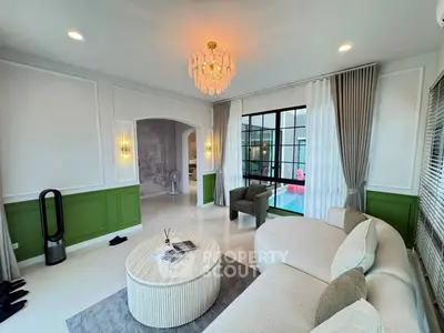 Elegant living room with modern chandelier and stylish furniture