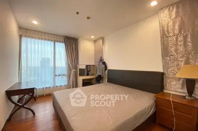 Spacious bedroom with city view and elegant decor