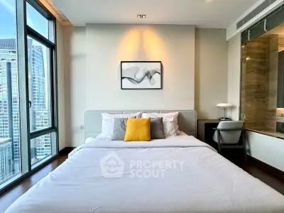 Luxurious bedroom with city view, modern decor, and ample natural light in high-rise apartment.