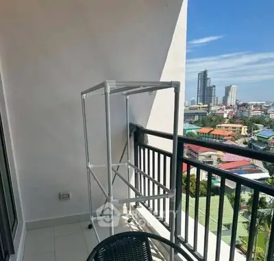 Spacious balcony with city view, perfect for relaxation and enjoying the skyline.