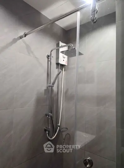 Modern bathroom shower with sleek design and gray tiles