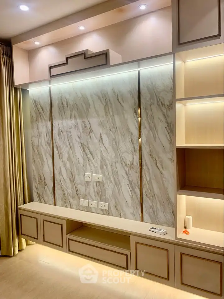 Luxurious living room with elegant marble wall and built-in shelving