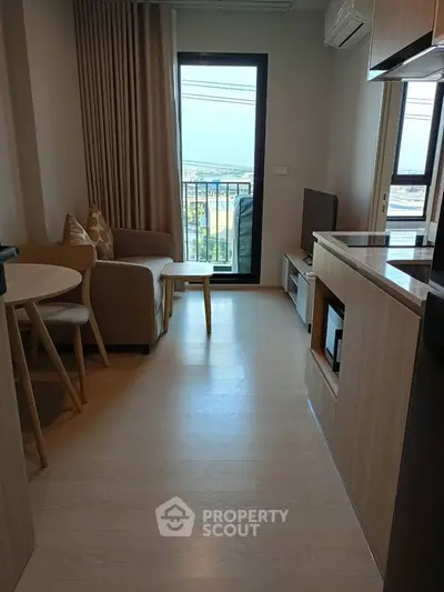 Cozy modern living room with balcony and scenic view