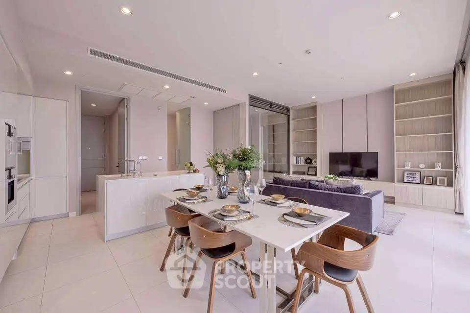 Luxurious open-plan living and dining area with modern decor and elegant furnishings.