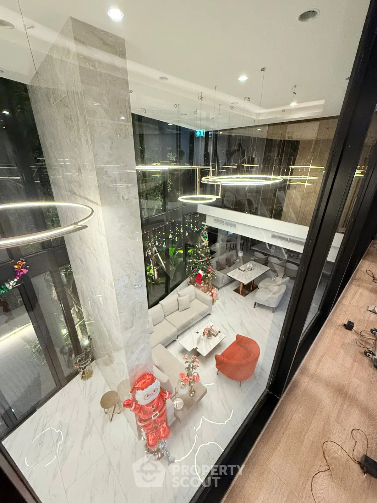 Luxurious modern living room with high ceilings and festive decor