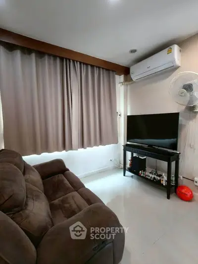 Cozy living room with plush sofa and modern entertainment setup