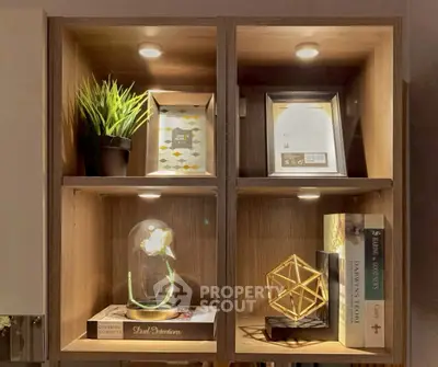 Stylish wooden shelving unit with decorative items and books, perfect for modern living room or study.