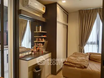 Cozy bedroom with modern decor and ample natural light
