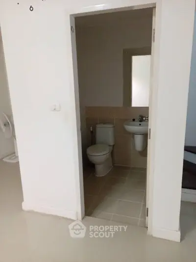 Compact bathroom with modern fixtures in a minimalist apartment