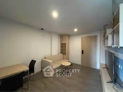 Modern living room with sleek furniture and built-in shelving, perfect for urban living.