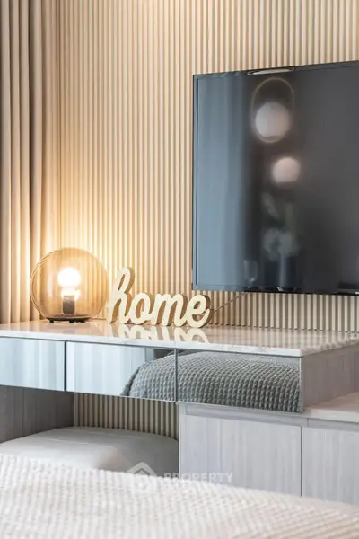 Modern living room with stylish decor and flat-screen TV