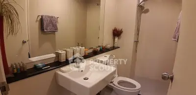 Modern bathroom with sleek fixtures and stylish decor in a contemporary home.