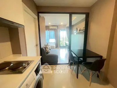 Modern apartment with cozy living room and compact kitchen area