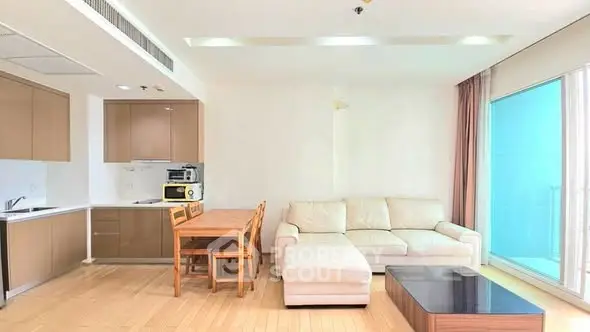 Spacious modern living room with open kitchen and elegant furniture