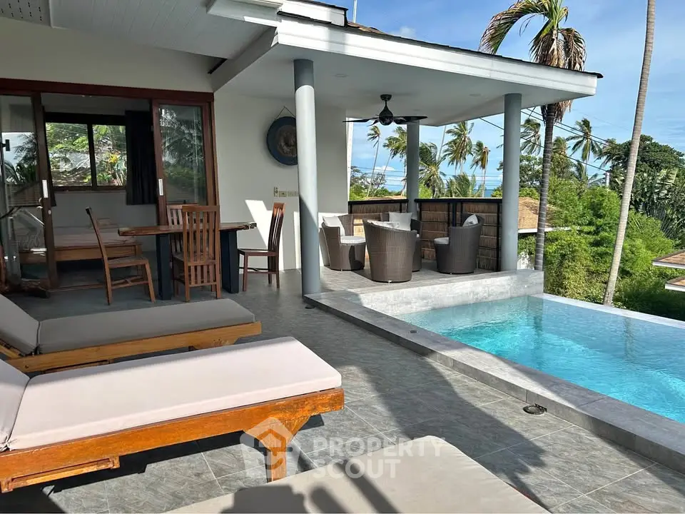 Luxurious tropical villa with private pool and stunning ocean view, perfect for relaxation and entertaining.