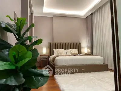 Luxurious bedroom with modern decor, plush bedding, and ambient lighting for ultimate comfort and relaxation.