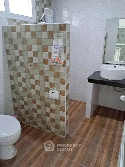 Modern bathroom with stylish tile design and sleek fixtures