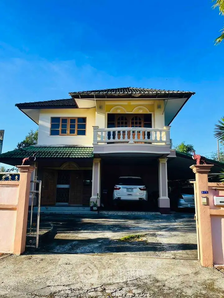 Charming two-story house with balcony and spacious driveway