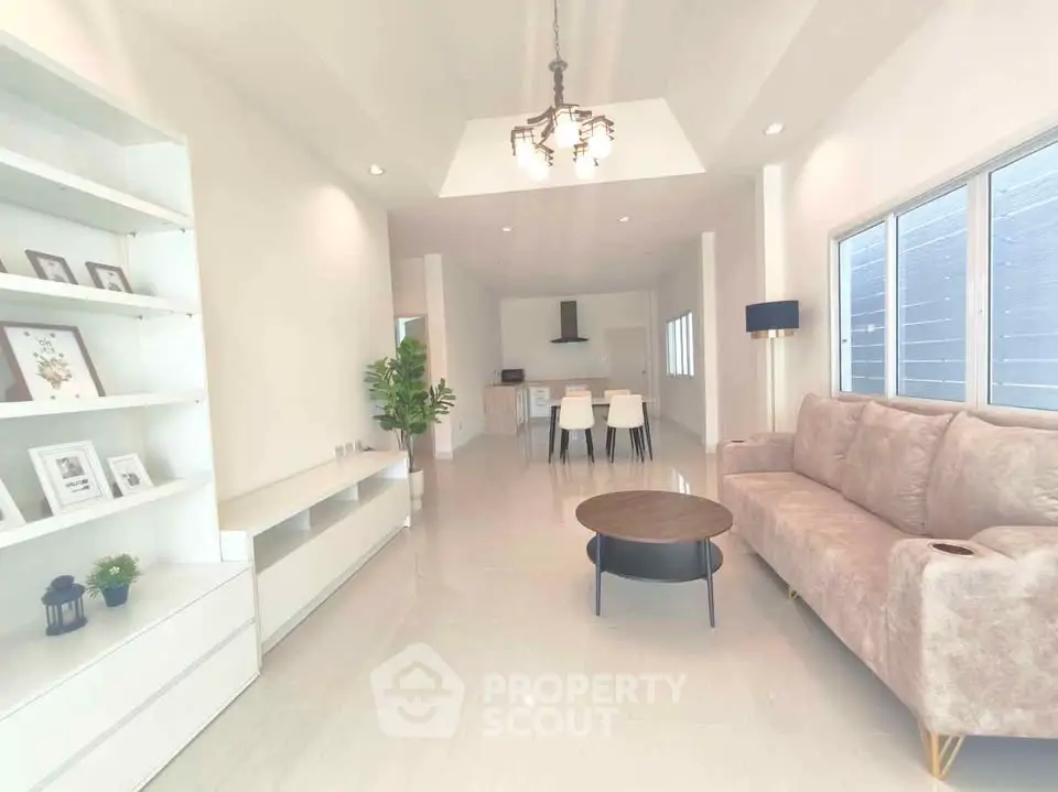 Spacious modern living room with elegant decor and open layout, perfect for family gatherings.