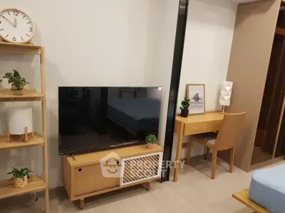 Modern living room with stylish wooden furniture and sleek TV setup