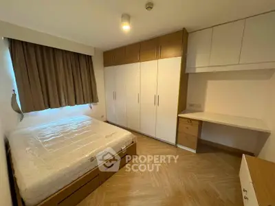 Modern bedroom with built-in wardrobe and cozy lighting