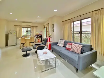 Spacious living room with modern furniture and natural light in a cozy home.