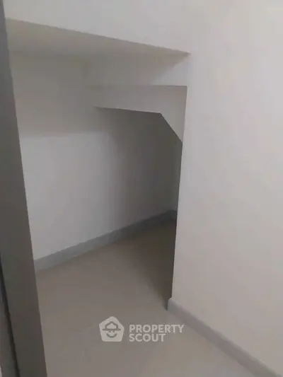 Compact storage space under stairs in modern home