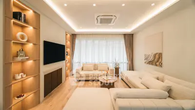 Luxurious modern living room with elegant lighting and cozy seating area.