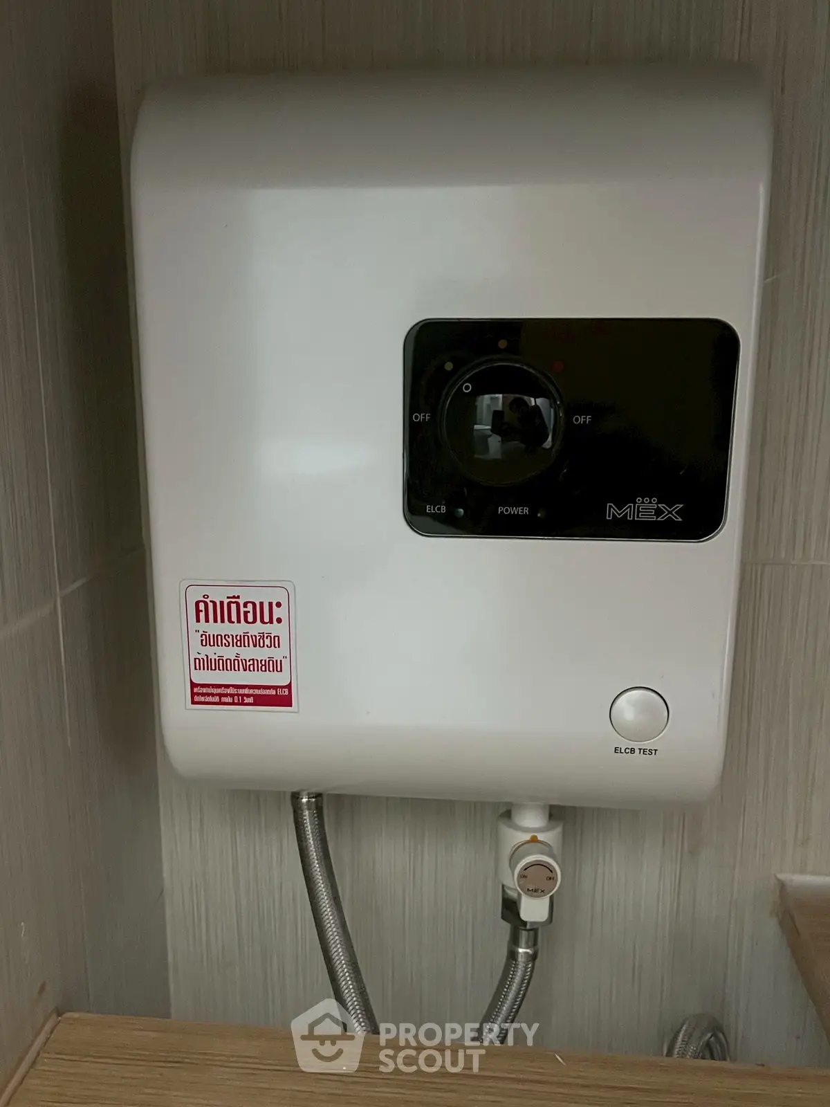Modern water heater installed in a stylish bathroom setting, showcasing sleek design and functionality.