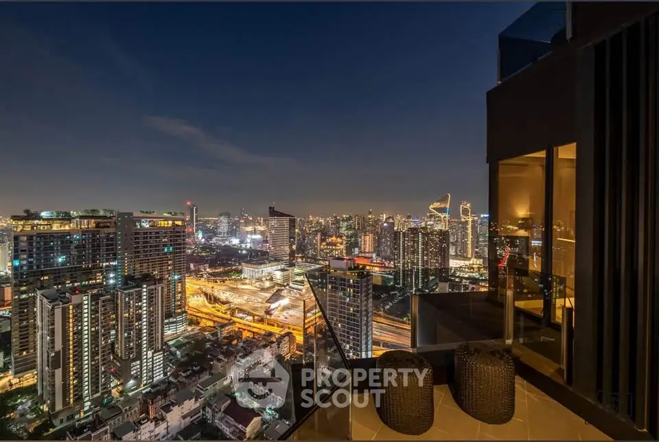 Stunning cityscape view from modern balcony at night