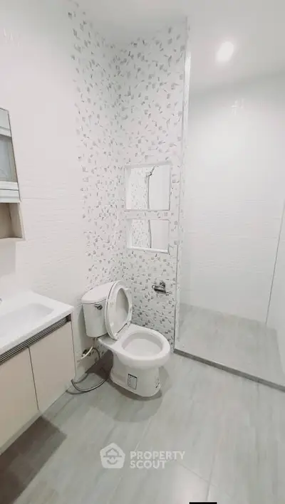 Modern bathroom with sleek design and spacious shower area