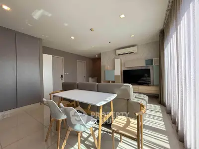 Spacious modern living room with stylish furniture and abundant natural light