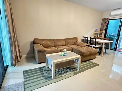 Spacious living room with cozy brown sofa and modern decor