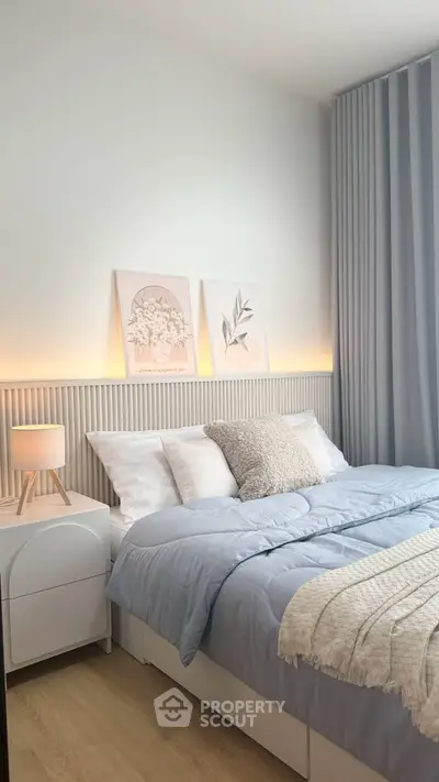 Cozy and stylish bedroom with modern decor and soft lighting, perfect for relaxation.