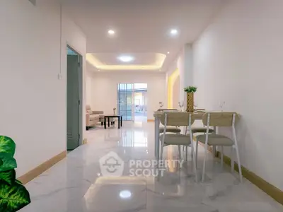 Spacious modern living room with elegant dining area and stylish decor