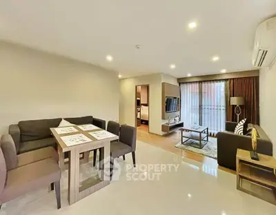 Spacious modern living room with dining area and natural light