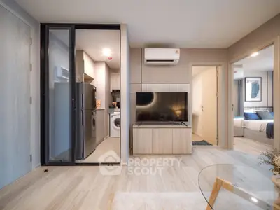 Modern living room with open kitchen and stylish decor