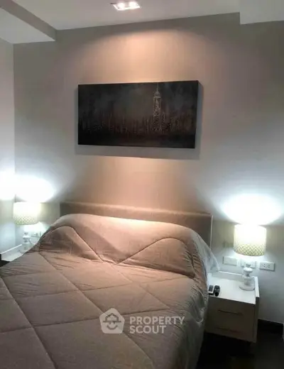 Cozy bedroom with modern decor and ambient lighting, perfect for relaxation.