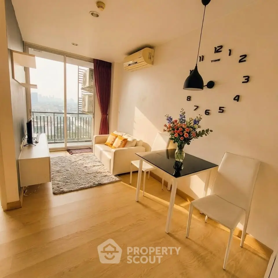 Bright modern living room with city view, cozy seating, and stylish decor.