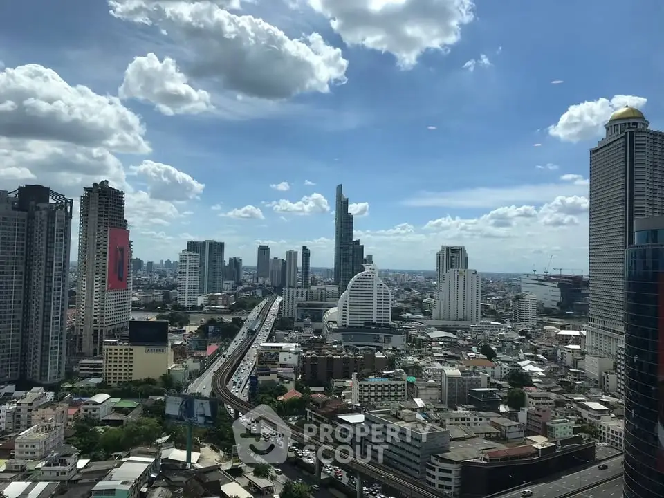 Stunning cityscape view showcasing modern skyscrapers and bustling urban life under a clear blue sky.