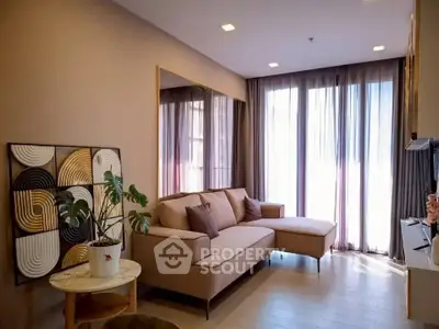 Stylish living room with modern decor and large windows for natural light