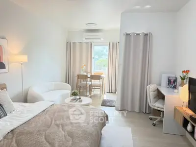 Modern studio apartment with cozy living area and stylish decor