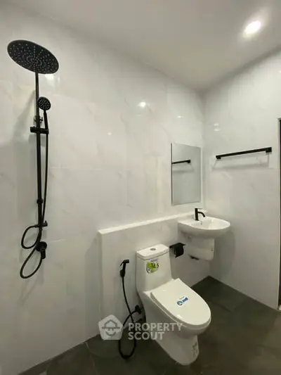 Modern bathroom with sleek fixtures and elegant tile design, perfect for a contemporary home.