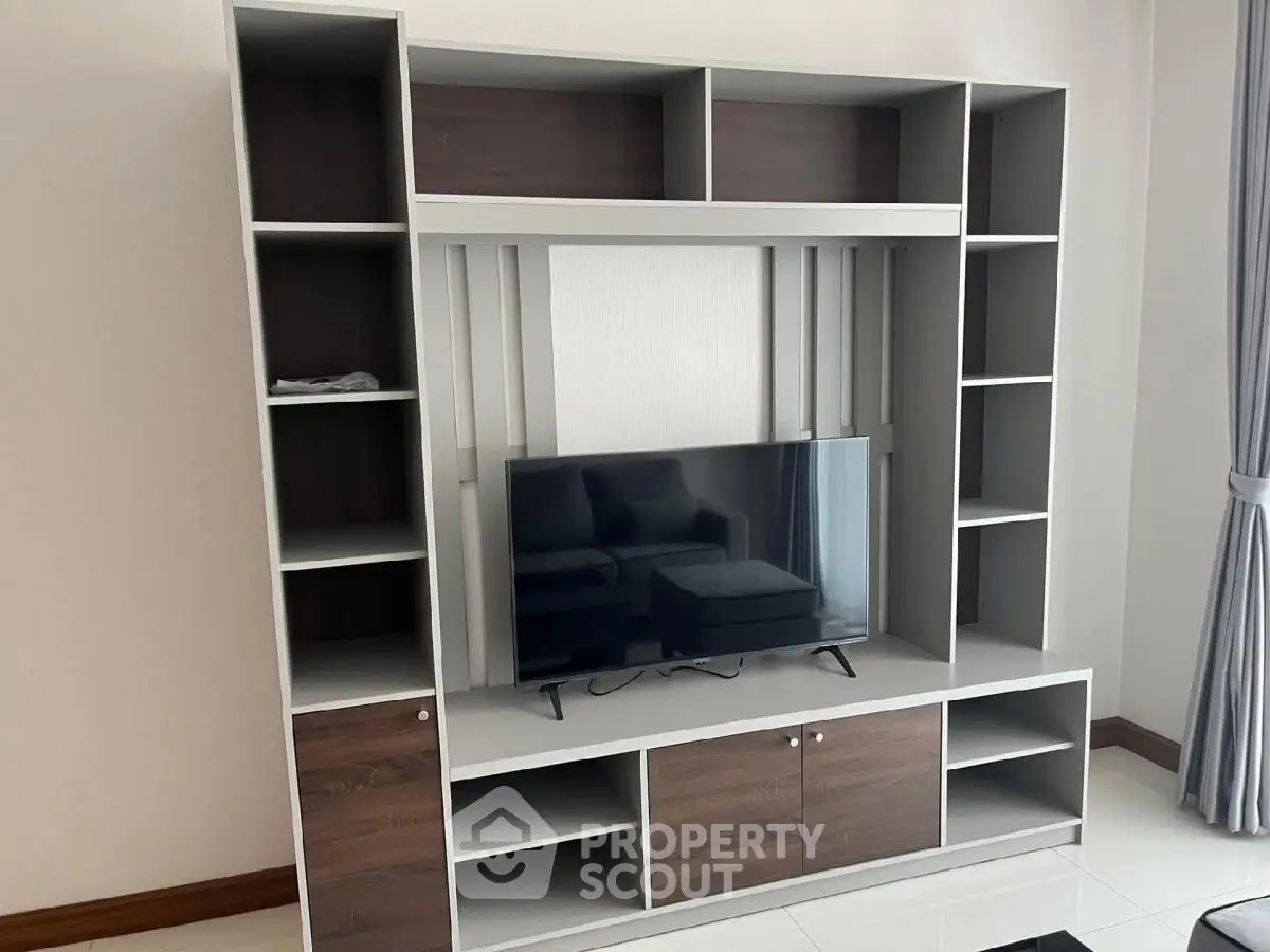 Modern living room with sleek TV stand and stylish shelving unit