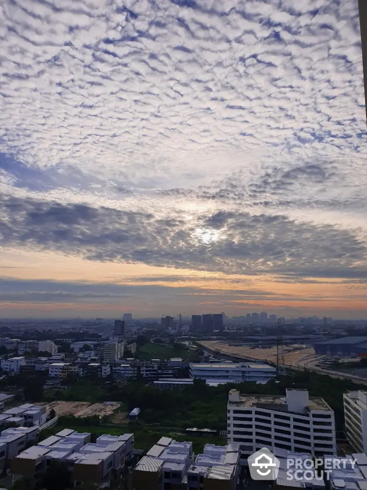 Stunning cityscape view with dramatic sky from high-rise building