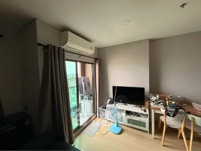 Modern living room with stylish decor and large TV setup