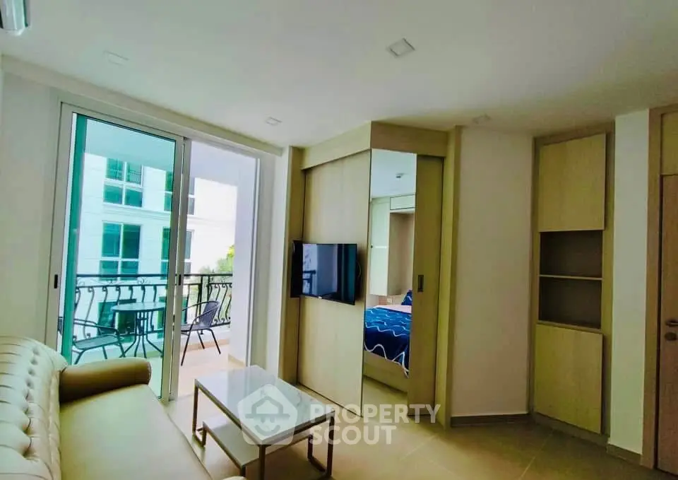 Modern living room with balcony access and sleek furniture design