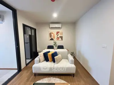 Modern living room with stylish decor and air conditioning in a cozy apartment.