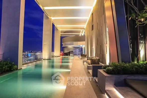 Luxurious rooftop pool with stunning city views and modern architectural design.